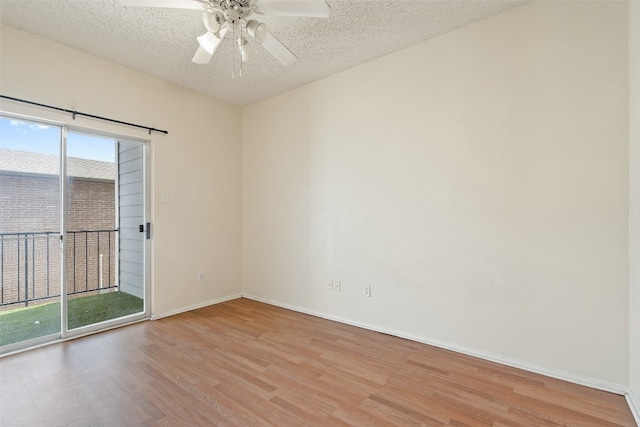 unfurnished room featuring ceiling fan, a textured ceiling, and light wood-type flooring