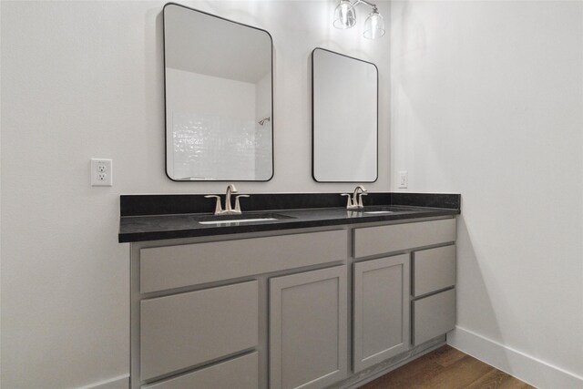 bathroom featuring vanity and hardwood / wood-style floors