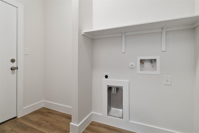 washroom with dark hardwood / wood-style floors, hookup for a gas dryer, hookup for a washing machine, and electric dryer hookup