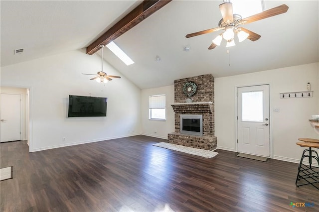 unfurnished living room with dark hardwood / wood-style floors, plenty of natural light, and a skylight