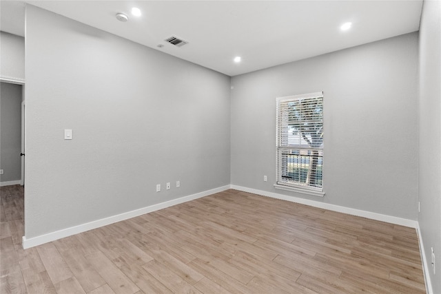 spare room with light wood-type flooring