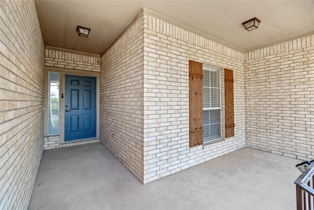 view of exterior entry featuring a porch