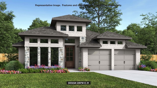 view of front of home featuring a garage and a front yard