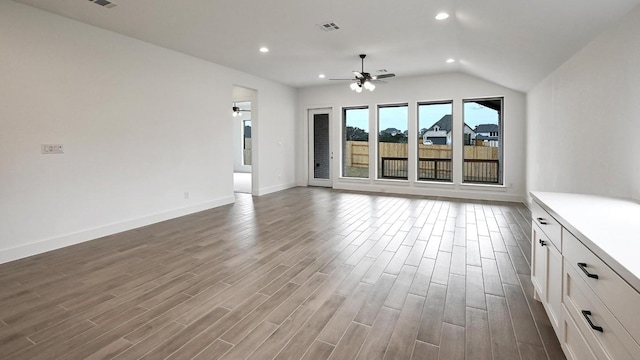 unfurnished living room featuring ceiling fan, visible vents, wood finished floors, and recessed lighting