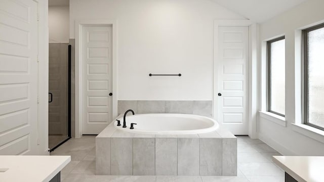 full bath with a bath, a stall shower, tile patterned flooring, and vanity