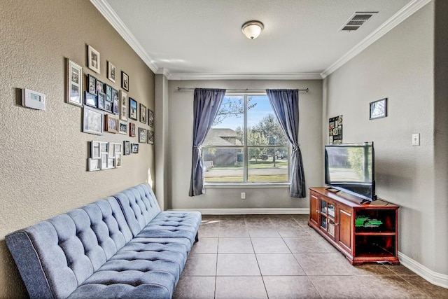 living area with tile patterned floors and crown molding