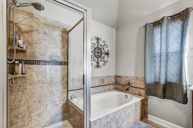 bathroom featuring separate shower and tub