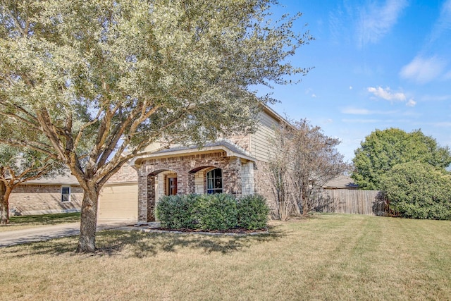 view of front of property with a front yard and a garage