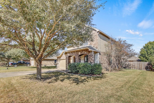 view of front of home with a front lawn and a garage