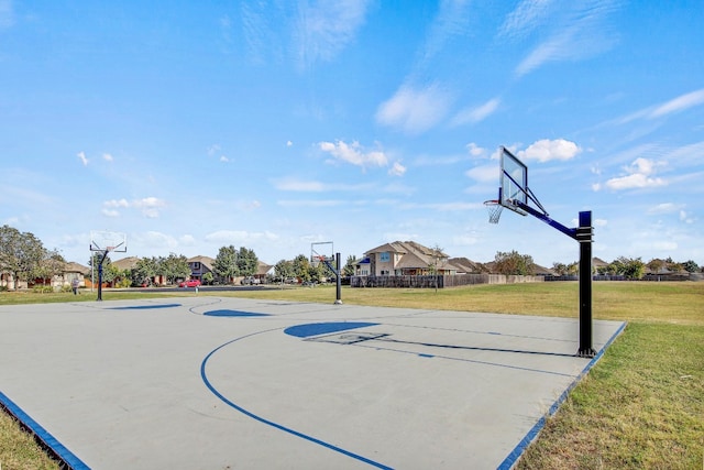 view of basketball court featuring a lawn