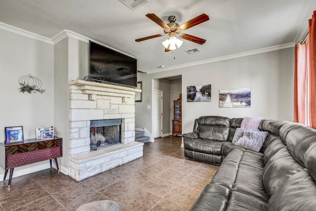 tiled living room with a textured ceiling, a fireplace, ceiling fan, and crown molding