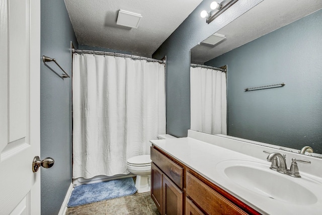 bathroom featuring vanity, a textured ceiling, toilet, and a shower with shower curtain