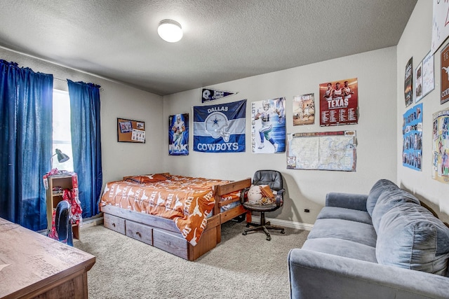 carpeted bedroom with a textured ceiling