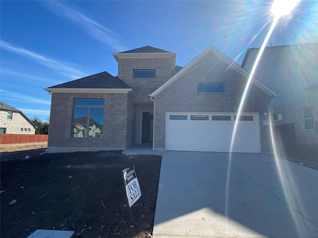 front facade with a garage