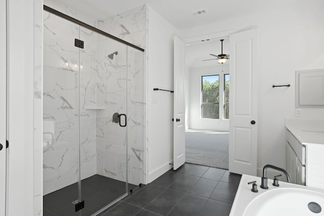 1515 Cardinal Ln, Round Rock, TX 78681 - bathroom featuring vanity, a marble finish shower, ceiling fan, tile patterned floors, and baseboards