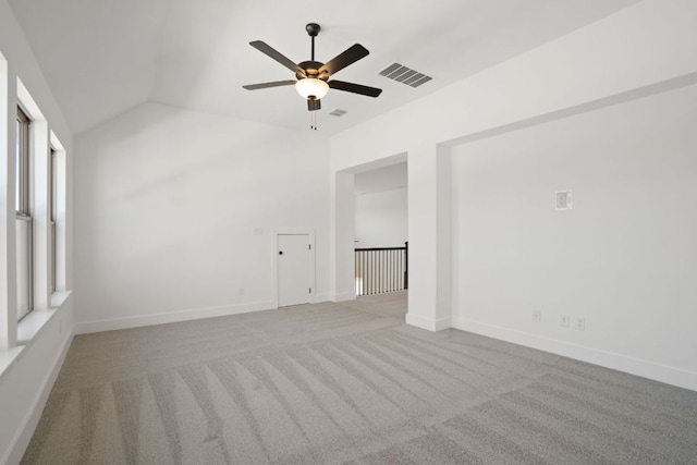 1515 Cardinal Ln, Round Rock, TX 78681 - empty room with ceiling fan, carpet flooring, lofted ceiling, and baseboards