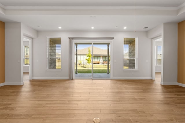 interior space featuring ornamental molding and light hardwood / wood-style flooring