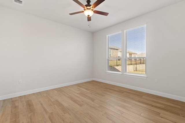 unfurnished room with light wood-type flooring and ceiling fan