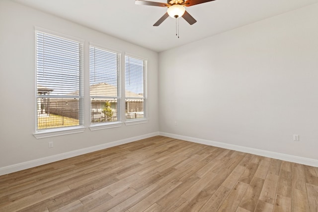 empty room with light wood-type flooring and ceiling fan