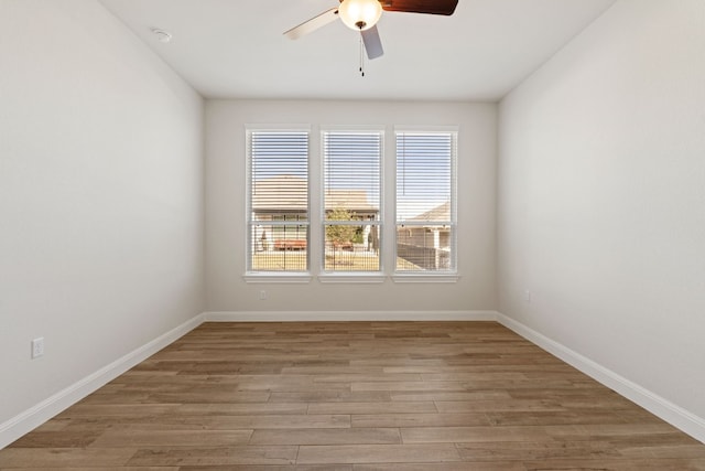 unfurnished room featuring hardwood / wood-style floors and ceiling fan