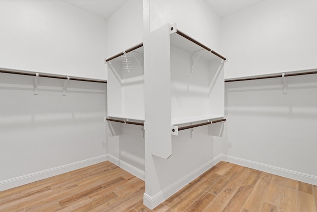 spacious closet featuring hardwood / wood-style flooring