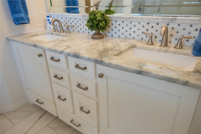 bathroom featuring tasteful backsplash, an enclosed shower, and vanity