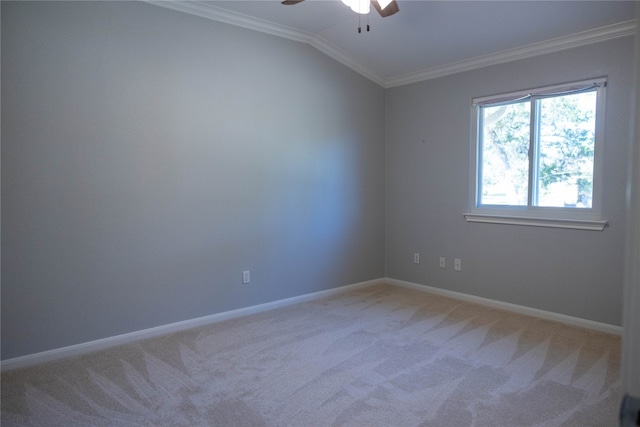 carpeted spare room with ornamental molding, lofted ceiling, and ceiling fan