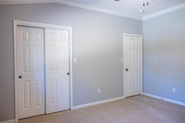 unfurnished bedroom featuring vaulted ceiling, light colored carpet, and ornamental molding