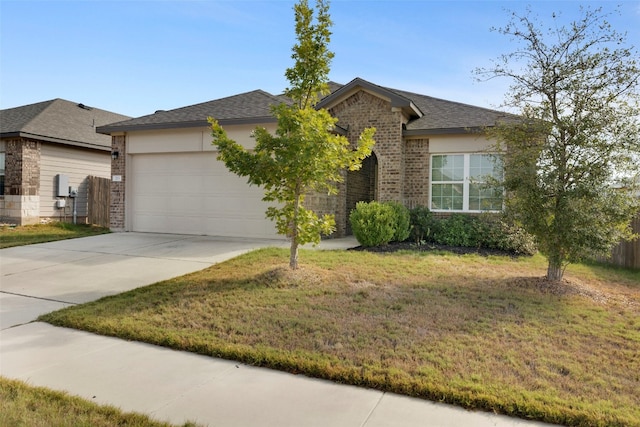 view of front of house with a garage and a front yard