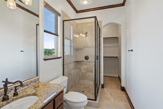 bathroom with an enclosed shower, plenty of natural light, vanity, and toilet