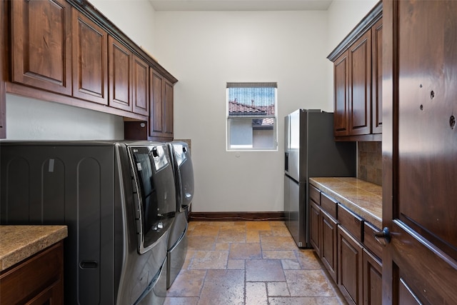 laundry area with cabinets and washer and dryer