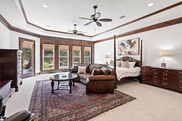 carpeted bedroom with ceiling fan, ornamental molding, a tray ceiling, and access to outside