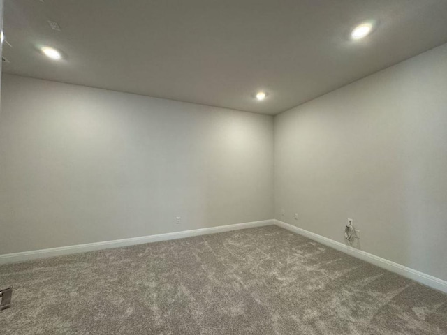 unfurnished room with recessed lighting, baseboards, and carpet flooring