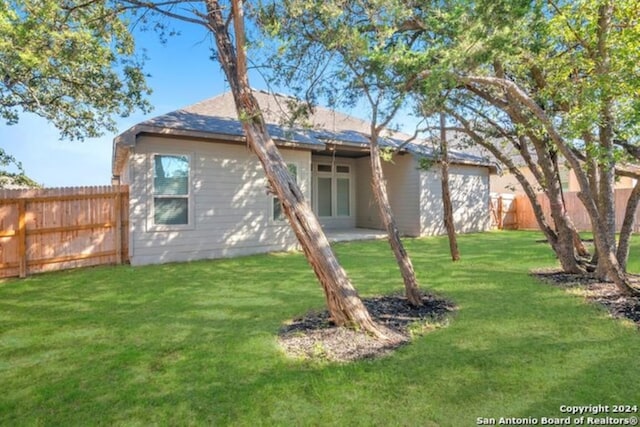 216 Fillmore Fls, Cibolo, TX 78108 - rear view of house featuring an attached garage