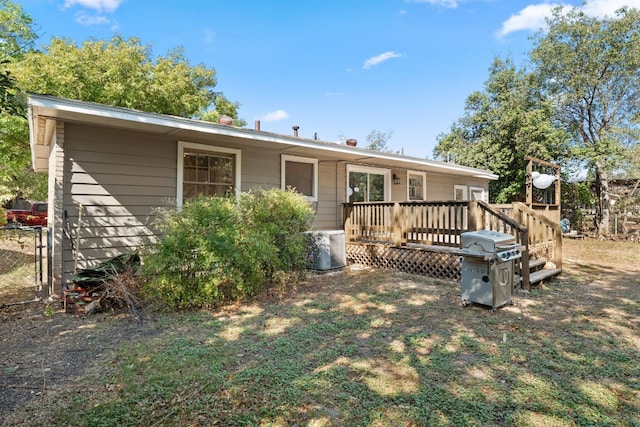 7909 Tisdale Dr, Austin, TX 78757 - rear view of property featuring a deck and central air condition unit