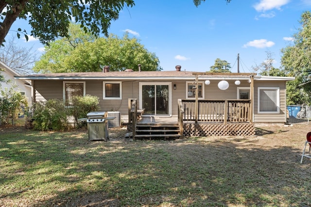 7909 Tisdale Dr, Austin, TX 78757 - back of property featuring a lawn and a wooden deck