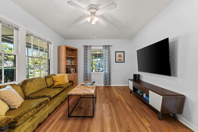 7909 Tisdale Dr, Austin, TX 78757 - living room featuring wood finished floors, baseboards, and a ceiling fan