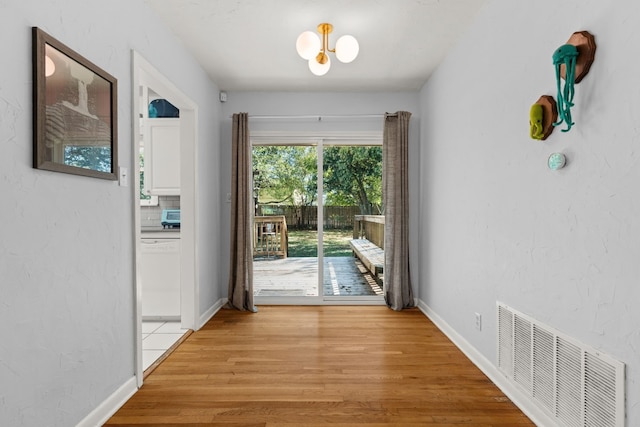 7909 Tisdale Dr, Austin, TX 78757 - entryway with light wood-style flooring and baseboards