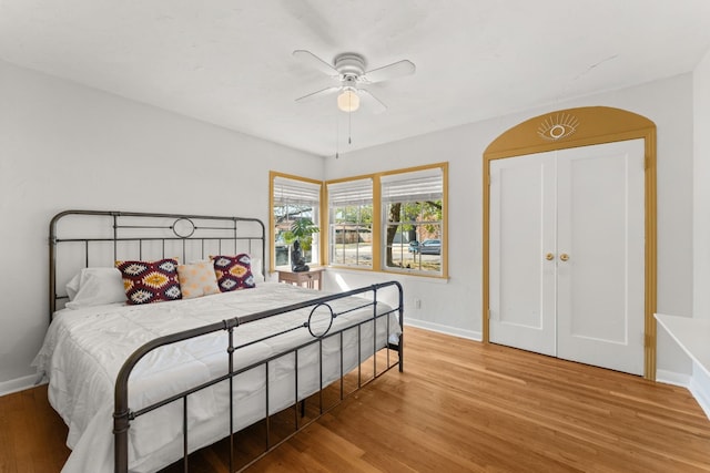 7909 Tisdale Dr, Austin, TX 78757 - bedroom with baseboards, light wood finished floors, and ceiling fan