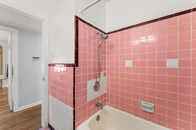 7909 Tisdale Dr, Austin, TX 78757 - full bathroom with shower / bath combination and wood finished floors