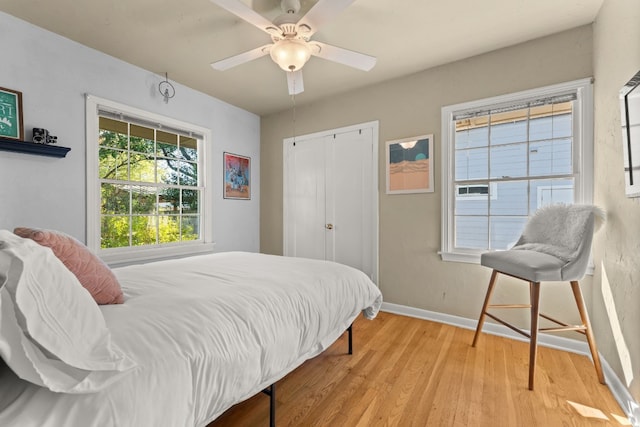 7909 Tisdale Dr, Austin, TX 78757 - bedroom featuring light wood-style flooring, baseboards, a closet, and a ceiling fan