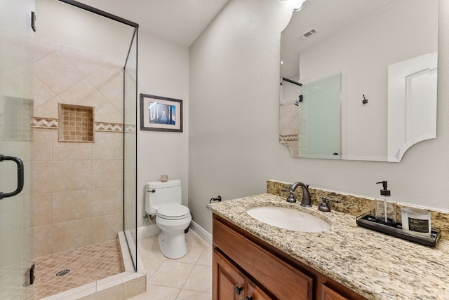 7409 Lantern View Dr, Jonestown, TX 78645 - bathroom with vanity, tile patterned flooring, toilet, a stall shower, and baseboards