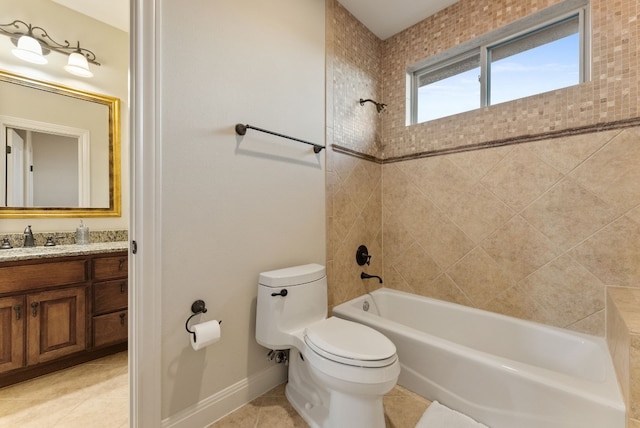 full bathroom with tile patterned floors, vanity, tiled shower / bath combo, and toilet