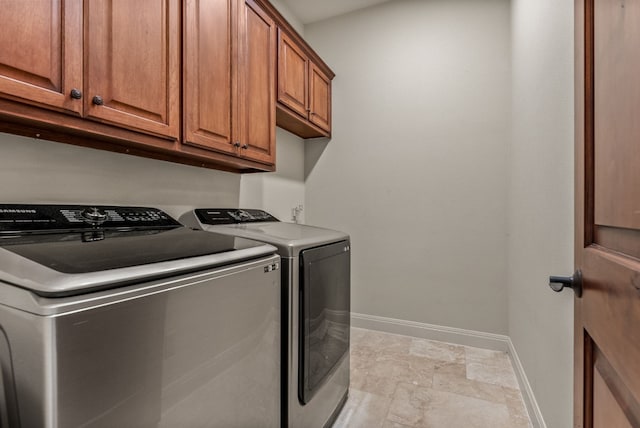 7409 Lantern View Dr, Jonestown, TX 78645 - laundry area with washing machine and dryer, baseboards, and cabinet space