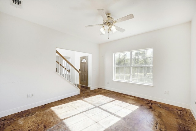 unfurnished living room with ceiling fan