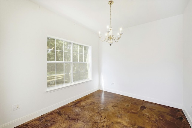 unfurnished dining area featuring concrete floors and a chandelier