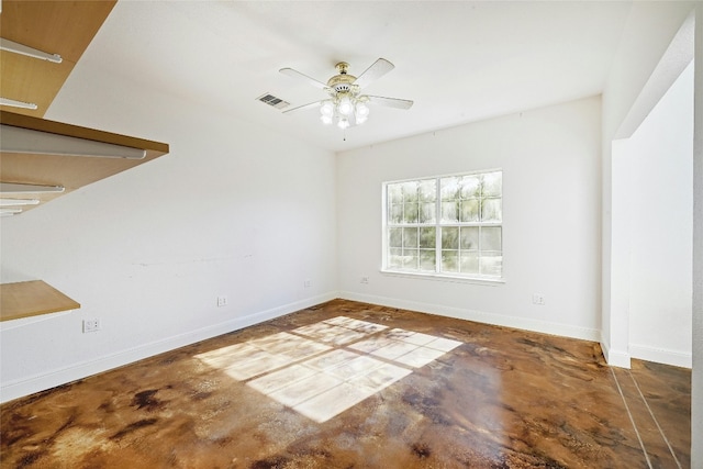 unfurnished room featuring concrete flooring and ceiling fan