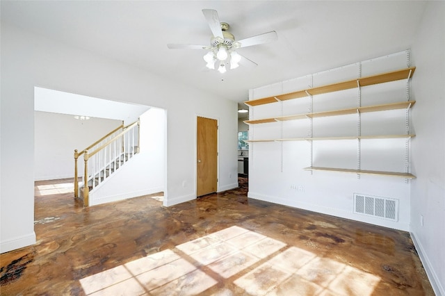 unfurnished room with ceiling fan