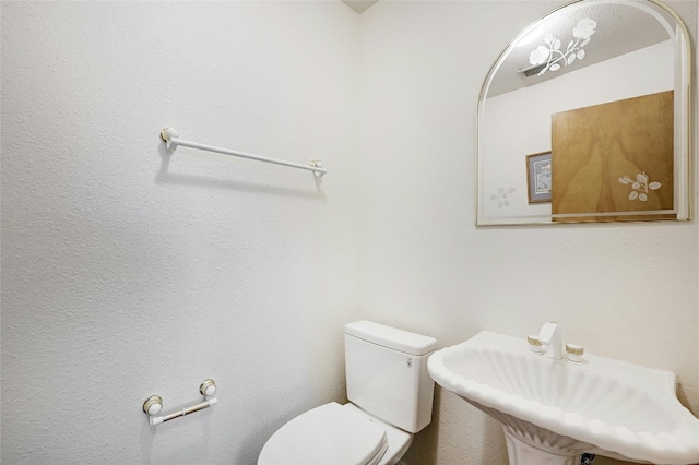 8302 N Madrone Trl, Austin, TX 78737 - bathroom with toilet and a sink