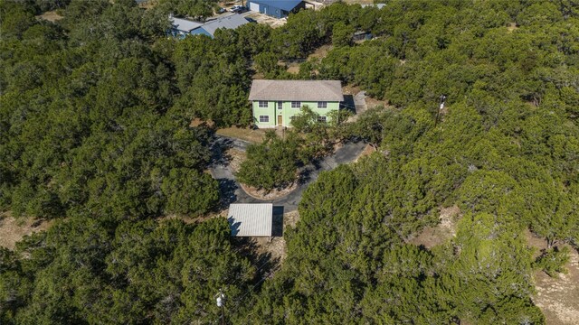8302 N Madrone Trl, Austin, TX 78737 - aerial view of property and surrounding area featuring a heavily wooded area